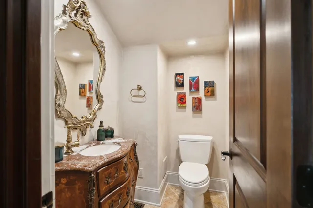 a kitchen with stainless steel appliances granite countertop a refrigerator a sink and a stove