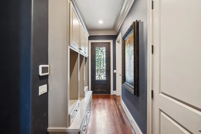 a front view of a house with swimming pool and sitting area