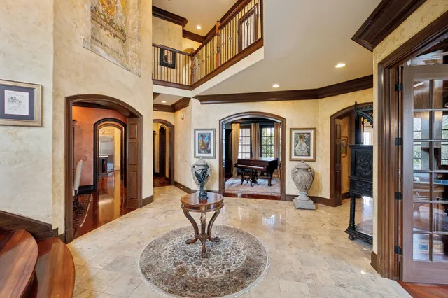 a bathroom with a granite countertop toilet sink and mirror