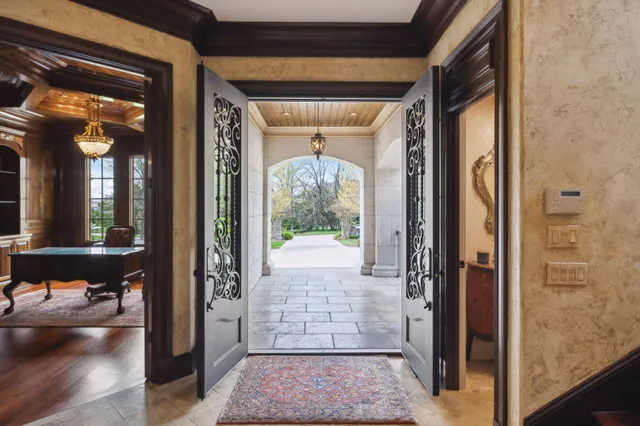 a living room with furniture a rug and a window