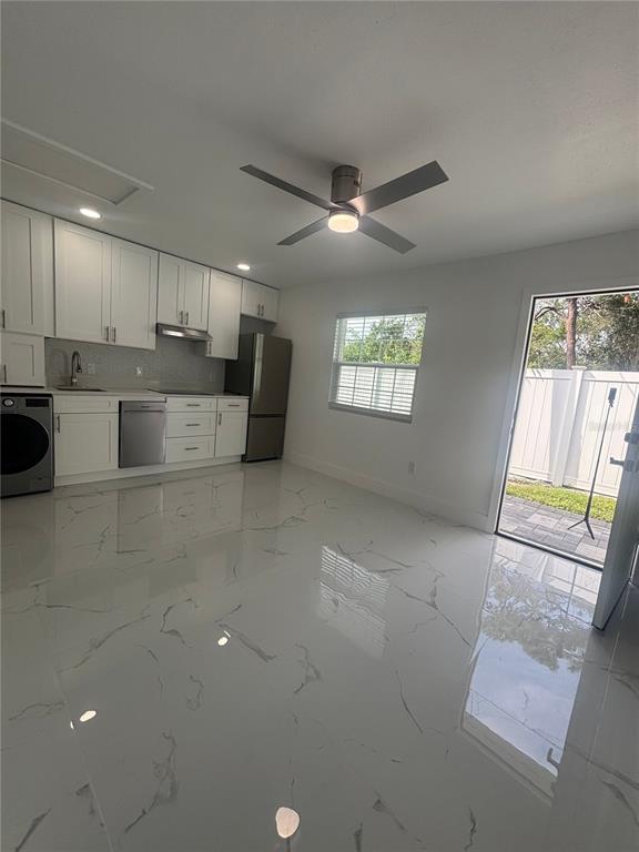 1524 Windermere Road, Unit A Winter Garden, FL 34787 - Photo 4 of 9 a view of kitchen with windows and ceiling fan