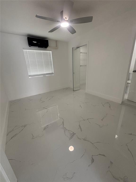 1524 Windermere Road, Unit A Winter Garden, FL 34787 - Photo 5 of 9 a view of an empty room with a window