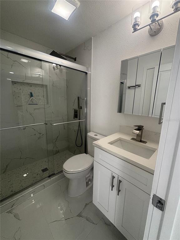 1524 Windermere Road, Unit A Winter Garden, FL 34787 - Photo 6 of 9 a bathroom with a sink toilet and shower