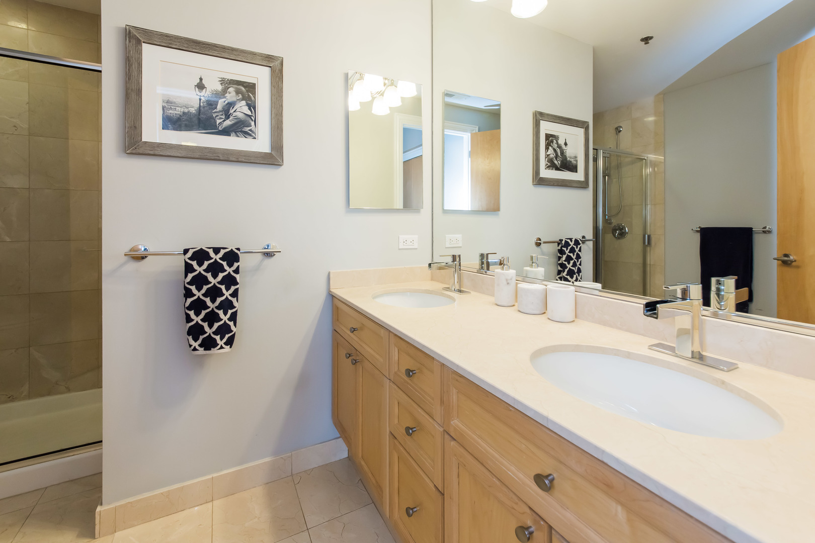 1201 West Adams Street, Unit 705 Chicago, IL 60607 - Photo 18 of 30 a bathroom with a double vanity sink mirror and