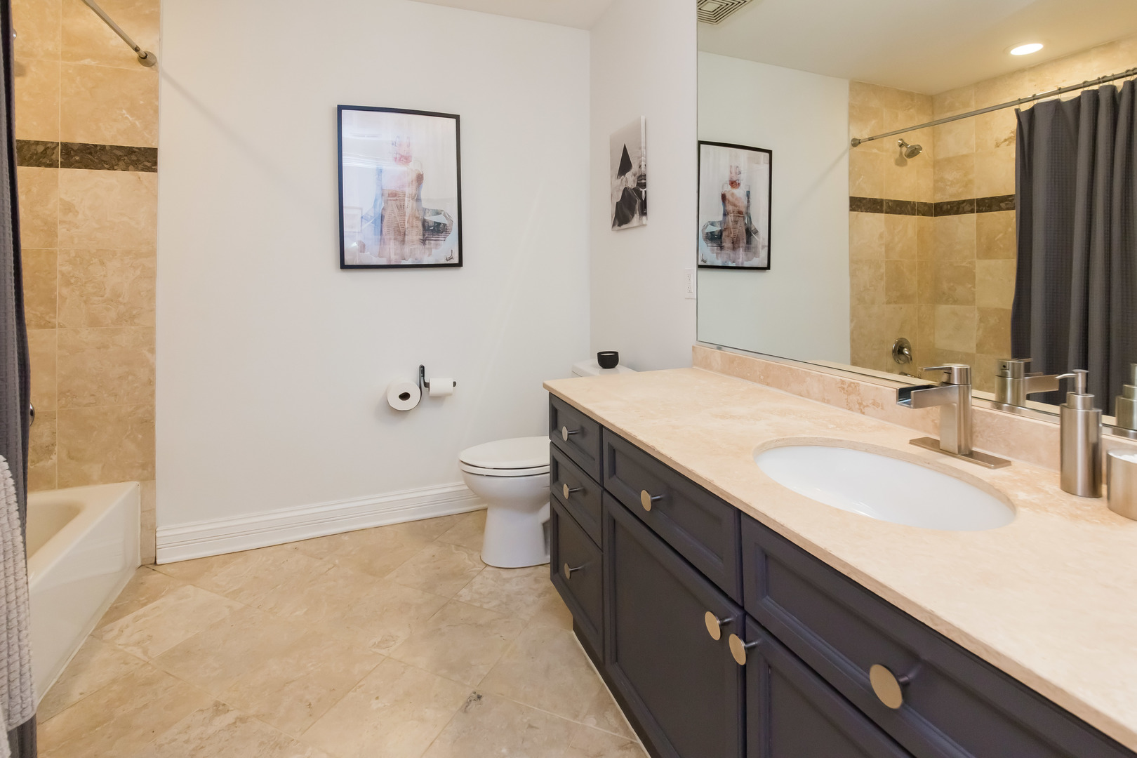 1201 West Adams Street, Unit 705 Chicago, IL 60607 - Photo 22 of 30 a bathroom with a double vanity sink mirror and toilet