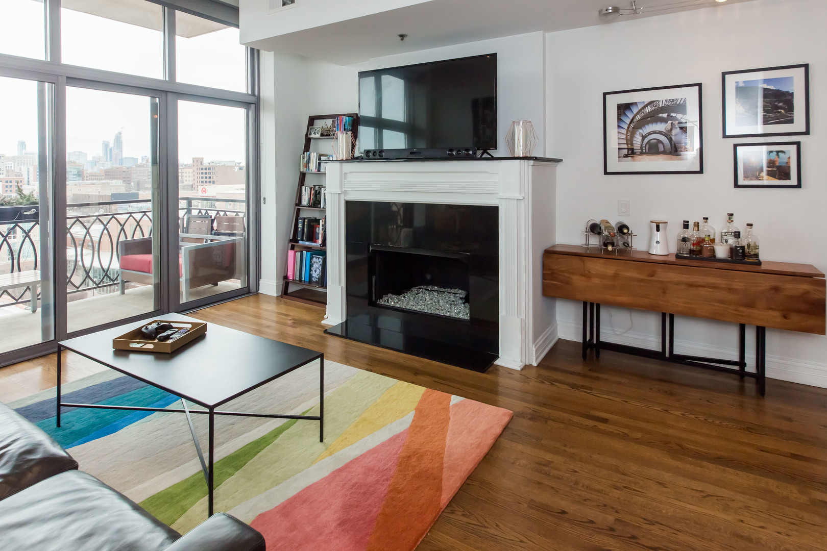 1201 West Adams Street, Unit 705 Chicago, IL 60607 - Photo 5 of 30 a living room with furniture fireplace and flat screen tv