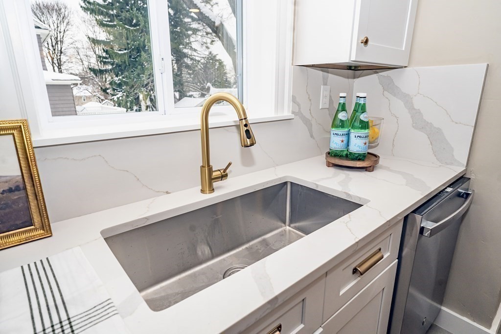 65 Hadwen Road Worcester, MA 01602 - Photo 14 of 38 a kitchen with a sink and a window
