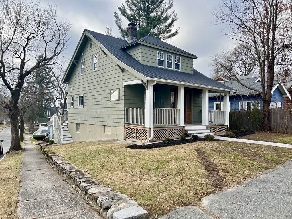 65 Hadwen Road Worcester, MA 01602 - Photo 2 of 38 a front view of a house with a yard
