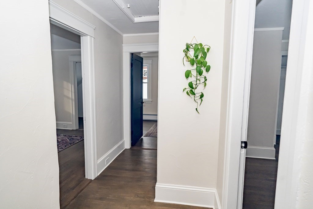 65 Hadwen Road Worcester, MA 01602 - Photo 26 of 38 a view of a hallway with wooden floor and front door