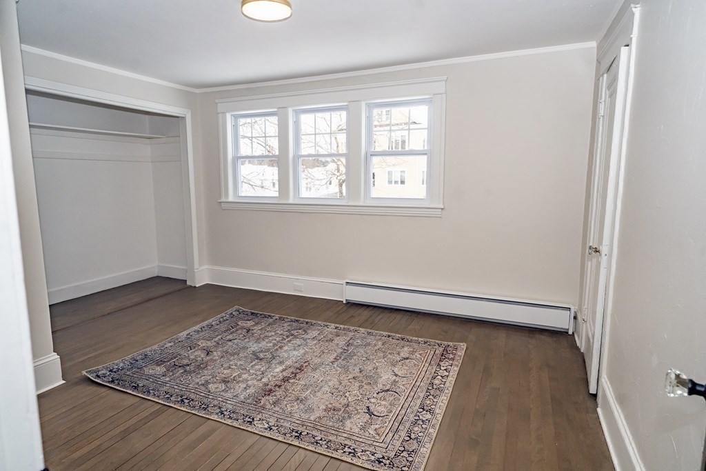 65 Hadwen Road Worcester, MA 01602 - Photo 27 of 38 an empty room with wooden floor and window