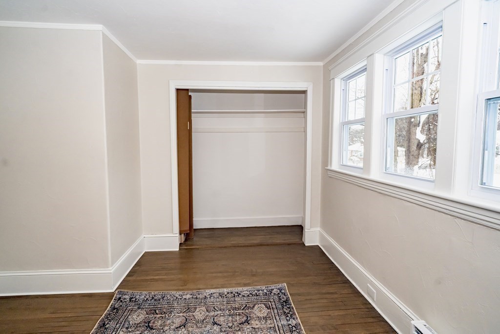 65 Hadwen Road Worcester, MA 01602 - Photo 28 of 38 a view of an empty room with wooden floor and a window