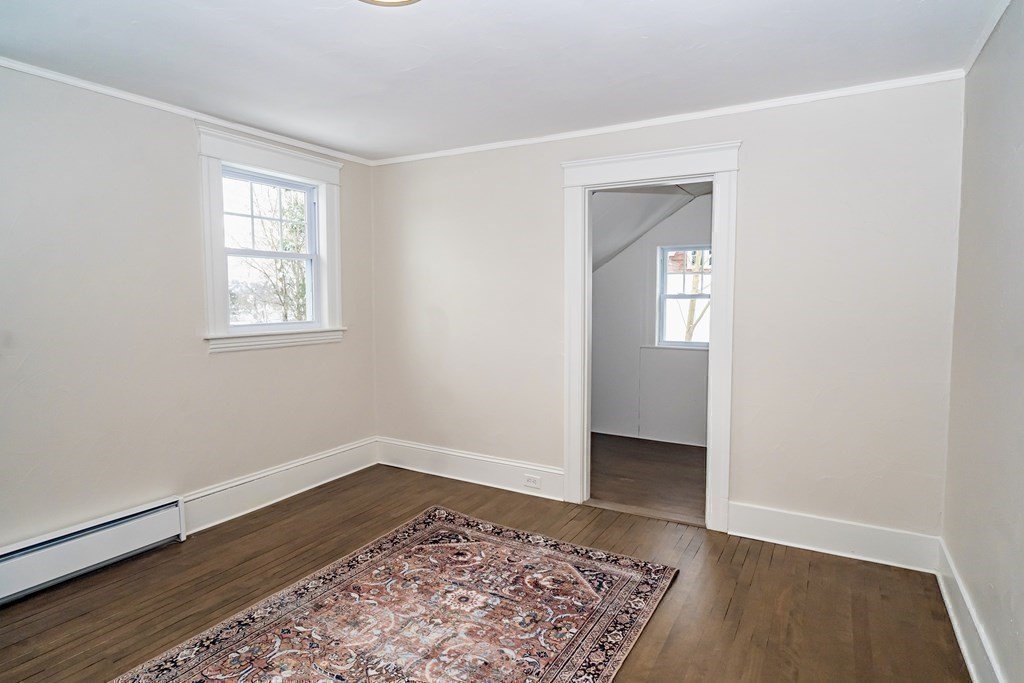 65 Hadwen Road Worcester, MA 01602 - Photo 30 of 38 an empty room with wooden floor and windows