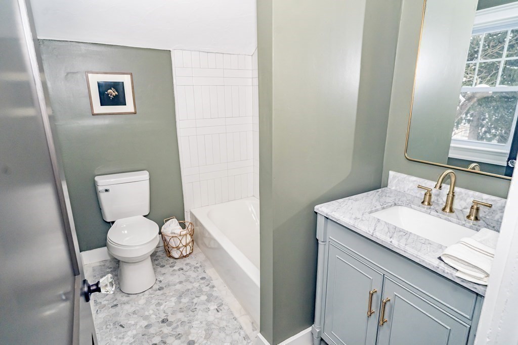 65 Hadwen Road Worcester, MA 01602 - Photo 34 of 38 a bathroom with a granite countertop toilet and a sink