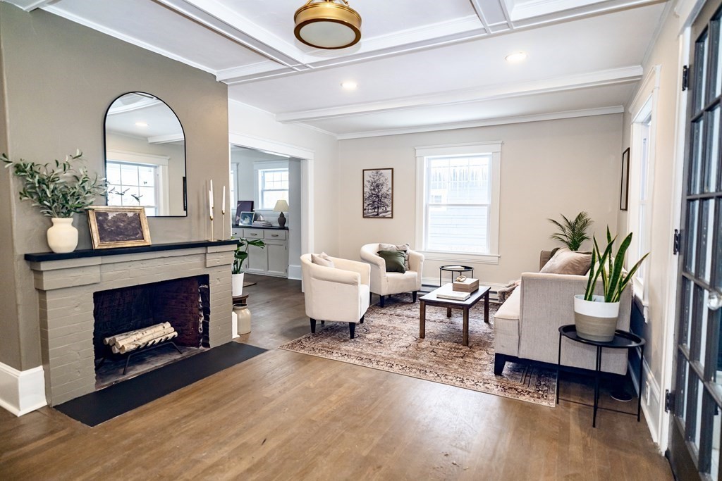 65 Hadwen Road Worcester, MA 01602 - Photo 8 of 38 a living room with furniture and a fireplace