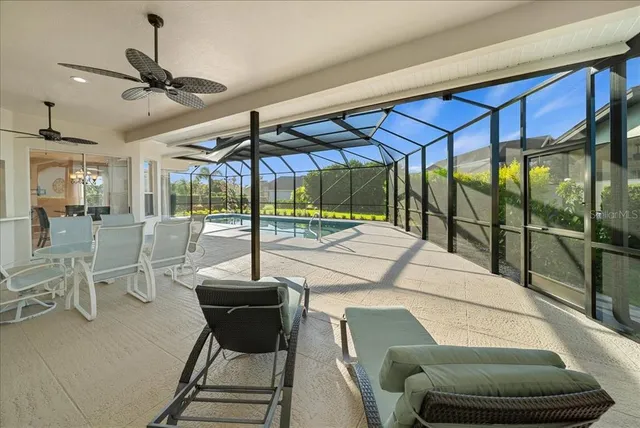 a bedroom with furniture and a floor to ceiling window