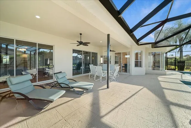 a living room with couch and glass door