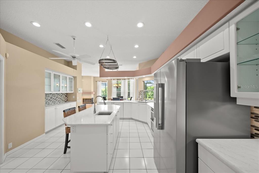 4321 Presidential Ave Circle East Bradenton, FL 34203 - Photo 6 of 49 a large white kitchen with a large window