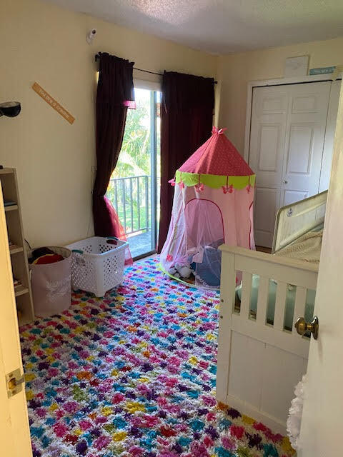 127 Woodland Road Palm Springs, FL 33461 - Photo 11 of 11 a bedroom with a bed and a window