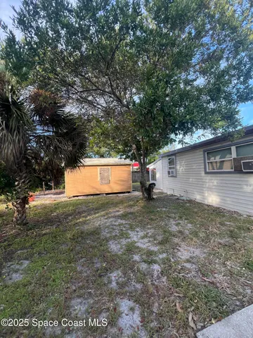 a house view with a backyard space