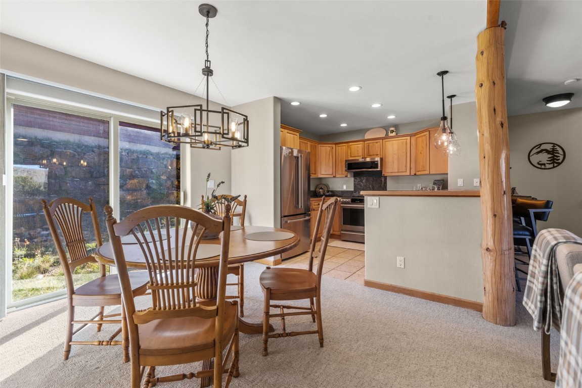 142 Lookout Ridge Drive Dillon, CO 80435 - Photo 16 of 39 Dining room with a chandelier