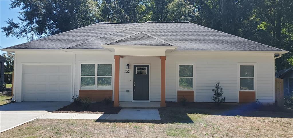 4231 Lindsey Drive Decatur, GA 30035 - Photo 1 of 1 a front view of a house with a yard