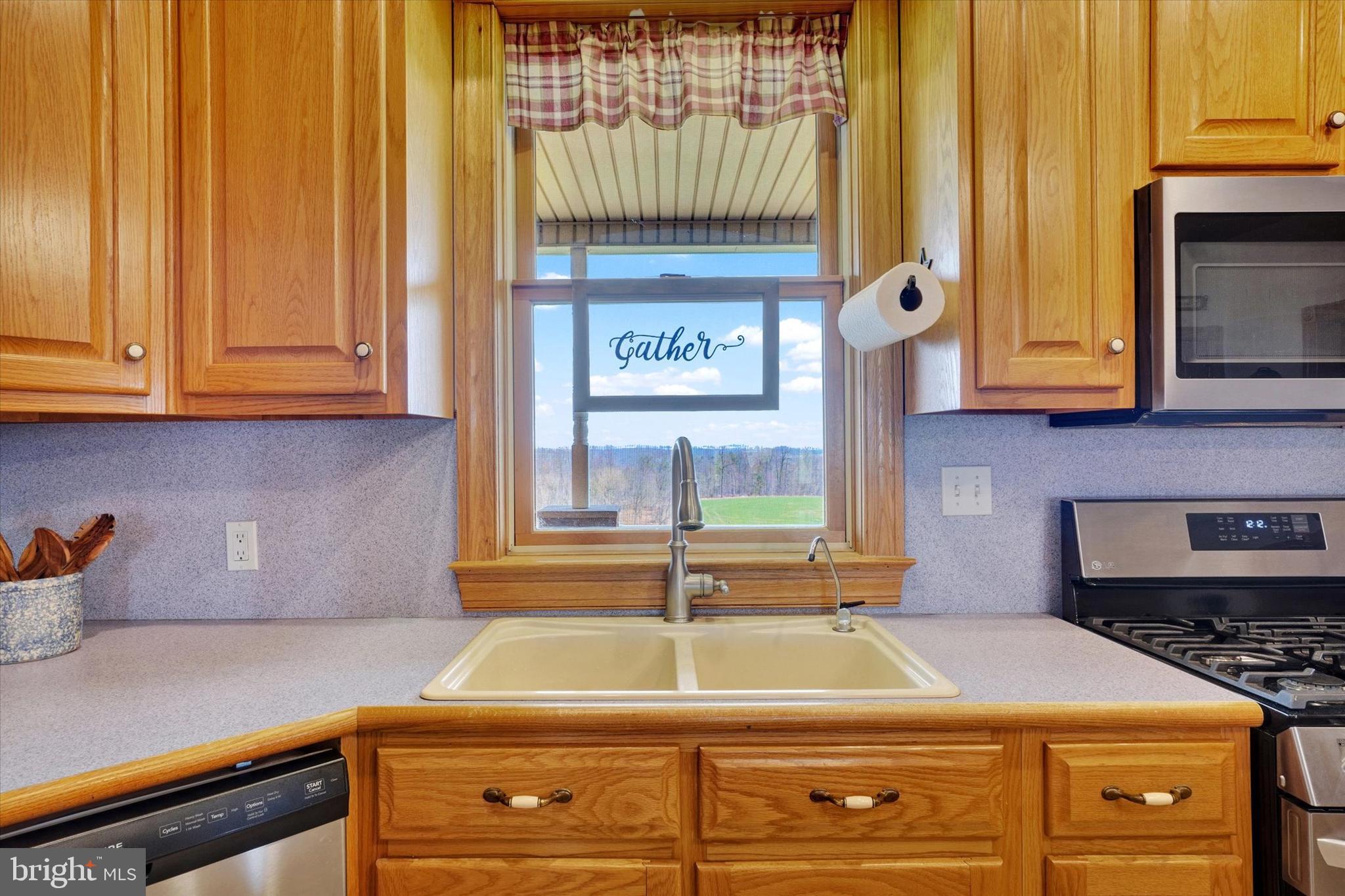 9185 High Rock Road New Park, PA 17352 - Photo 13 of 52 a kitchen with granite countertop a stove and a cabinet