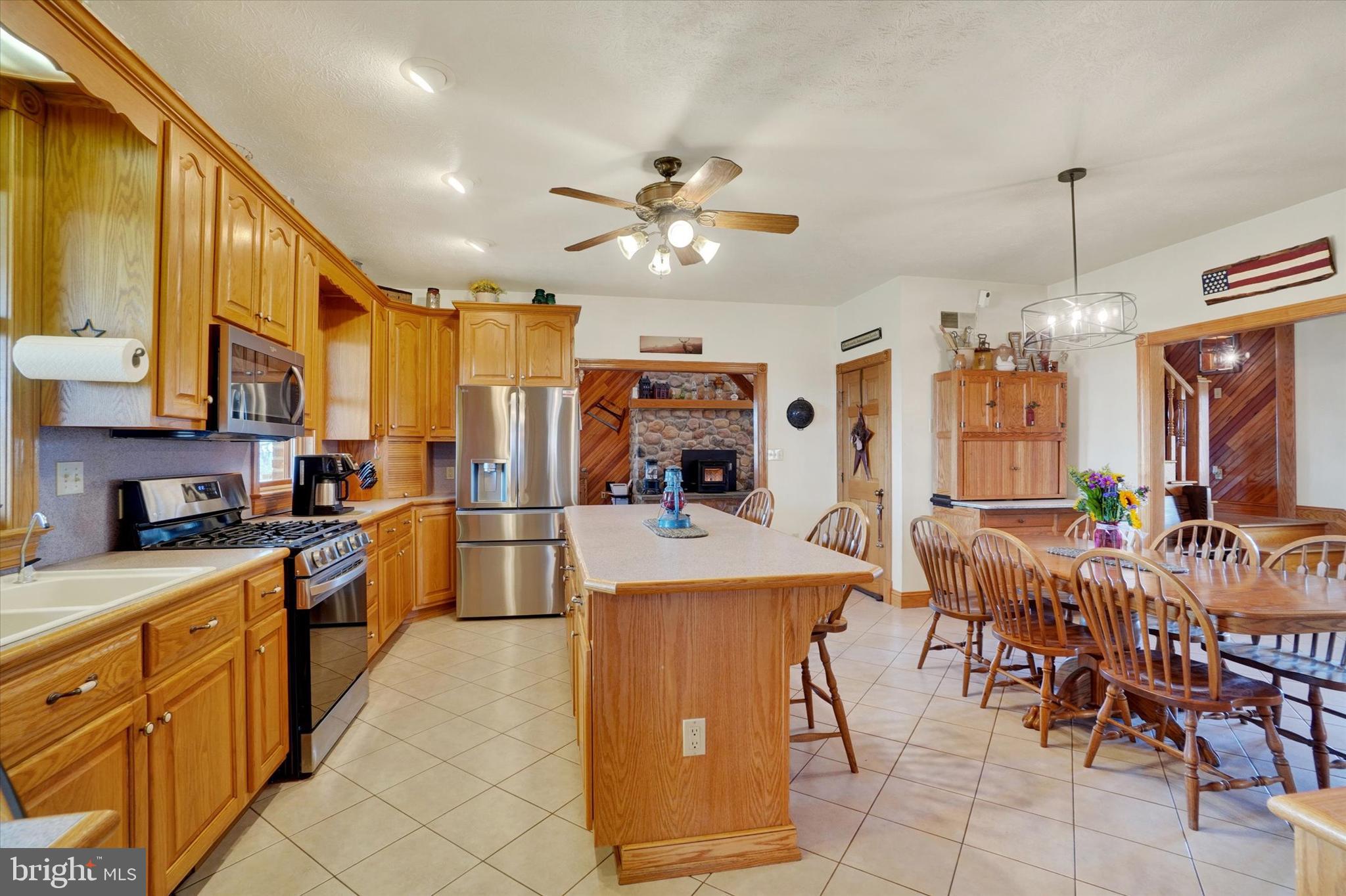 9185 High Rock Road New Park, PA 17352 - Photo 14 of 52 a large kitchen with lots of counter top space and stainless steel appliances
