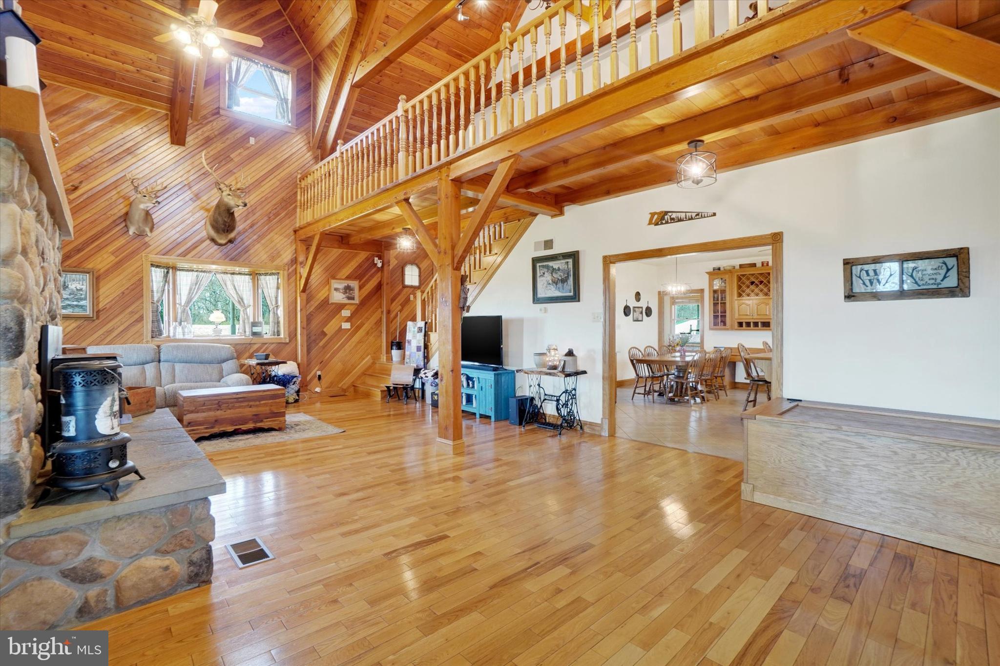 9185 High Rock Road New Park, PA 17352 - Photo 16 of 52 a living room with lots of furniture and kitchen view