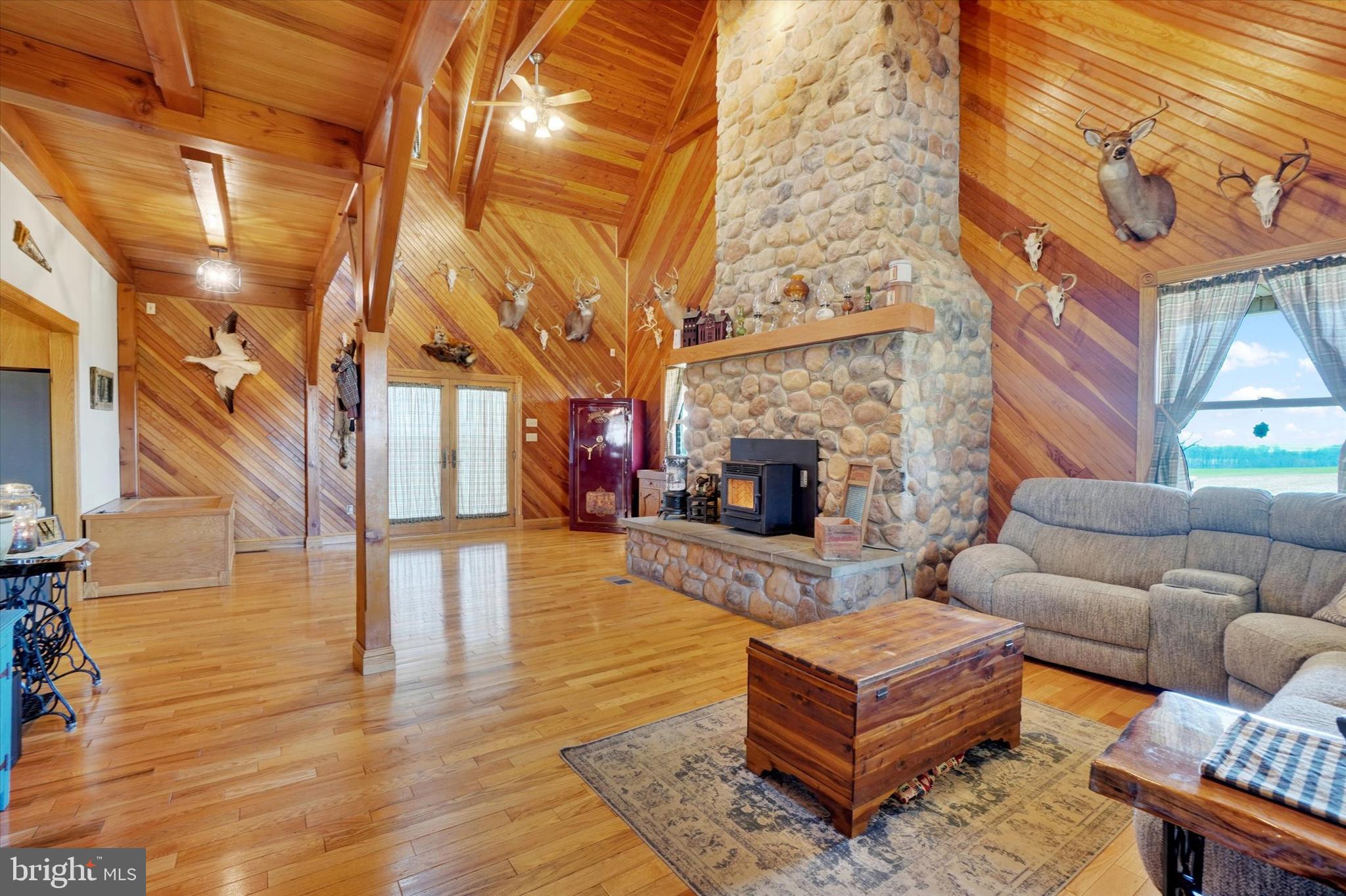 9185 High Rock Road New Park, PA 17352 - Photo 17 of 52 a living room with furniture and a fireplace