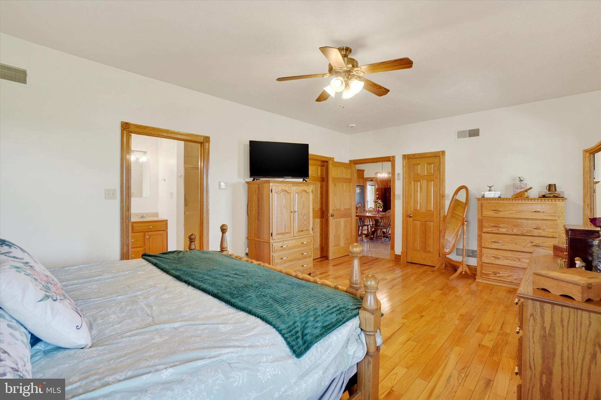 9185 High Rock Road New Park, PA 17352 - Photo 19 of 52 a bedroom with a bed and wooden floor