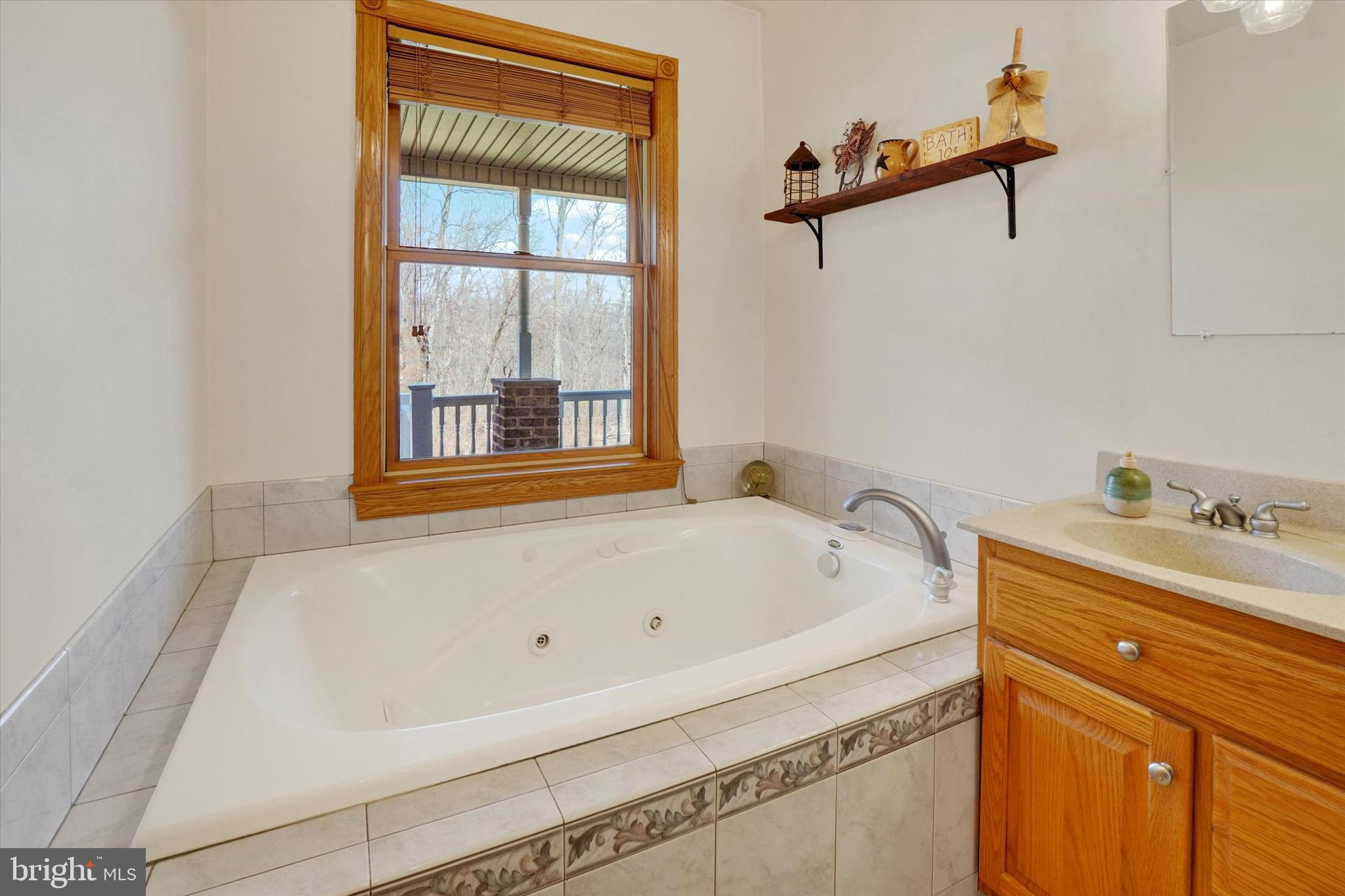 9185 High Rock Road New Park, PA 17352 - Photo 21 of 52 a bathroom with a bathtub and a window