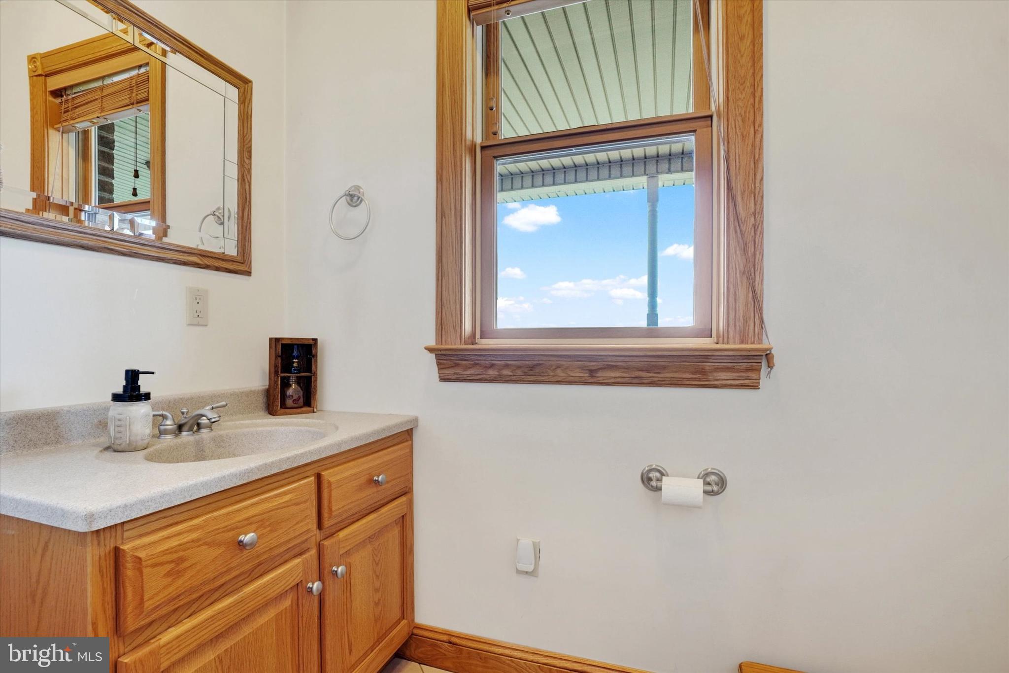 9185 High Rock Road New Park, PA 17352 - Photo 23 of 52 a bathroom with a sink a vanity and a mirror
