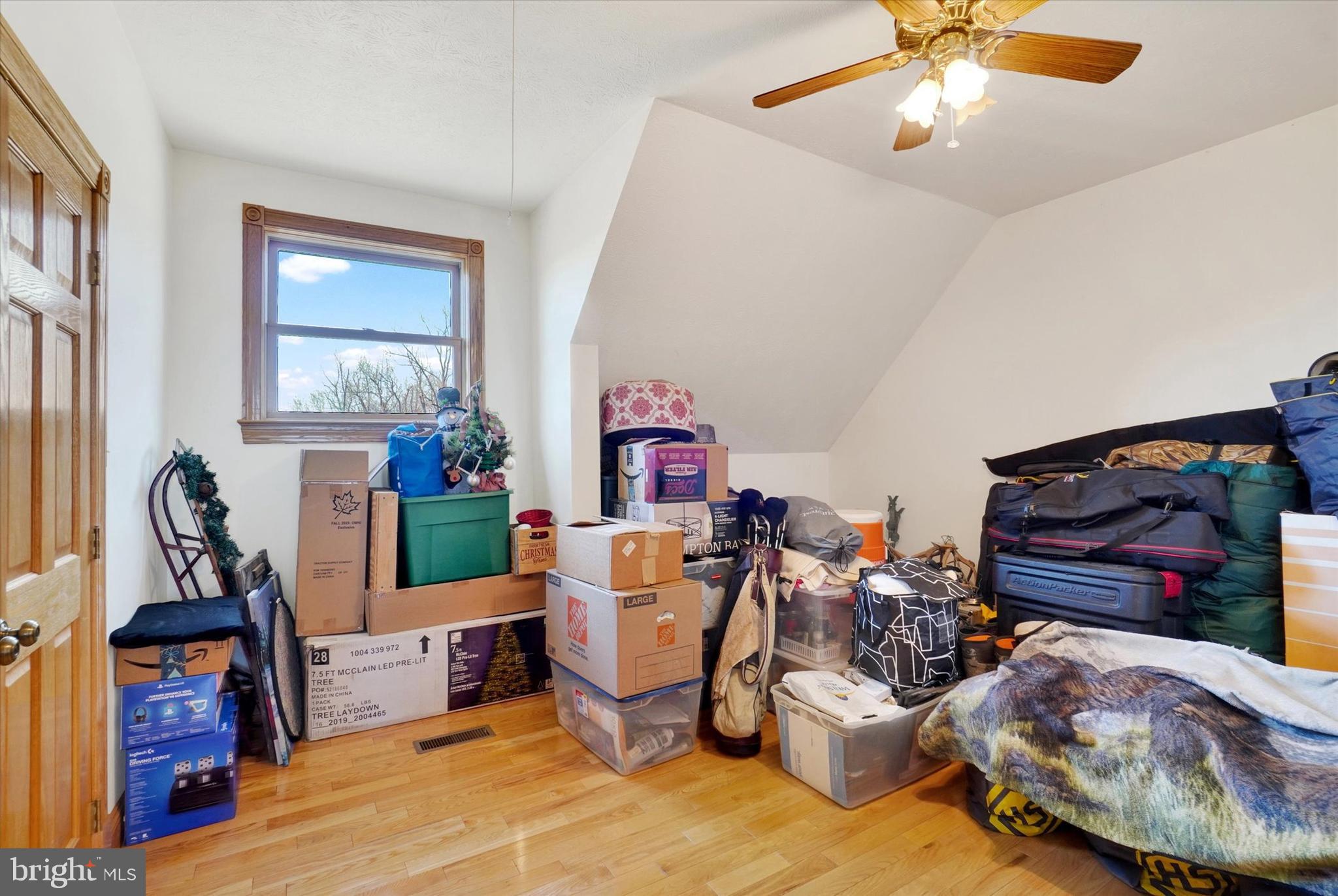 9185 High Rock Road New Park, PA 17352 - Photo 29 of 52 a living room with furniture and a flat screen tv