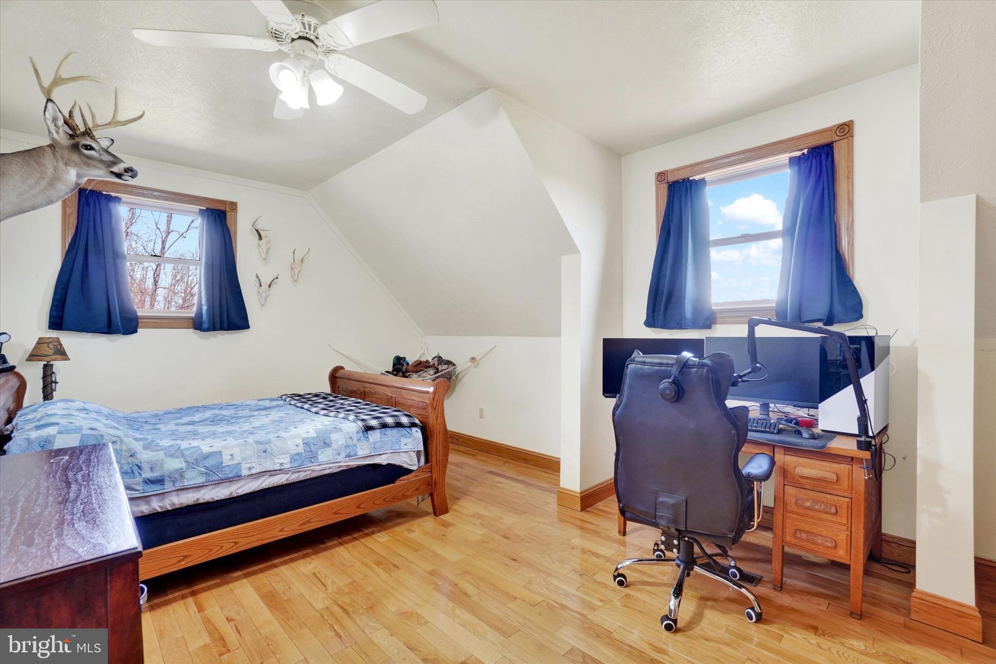 9185 High Rock Road New Park, PA 17352 - Photo 31 of 52 a bedroom with a bed and wooden floor