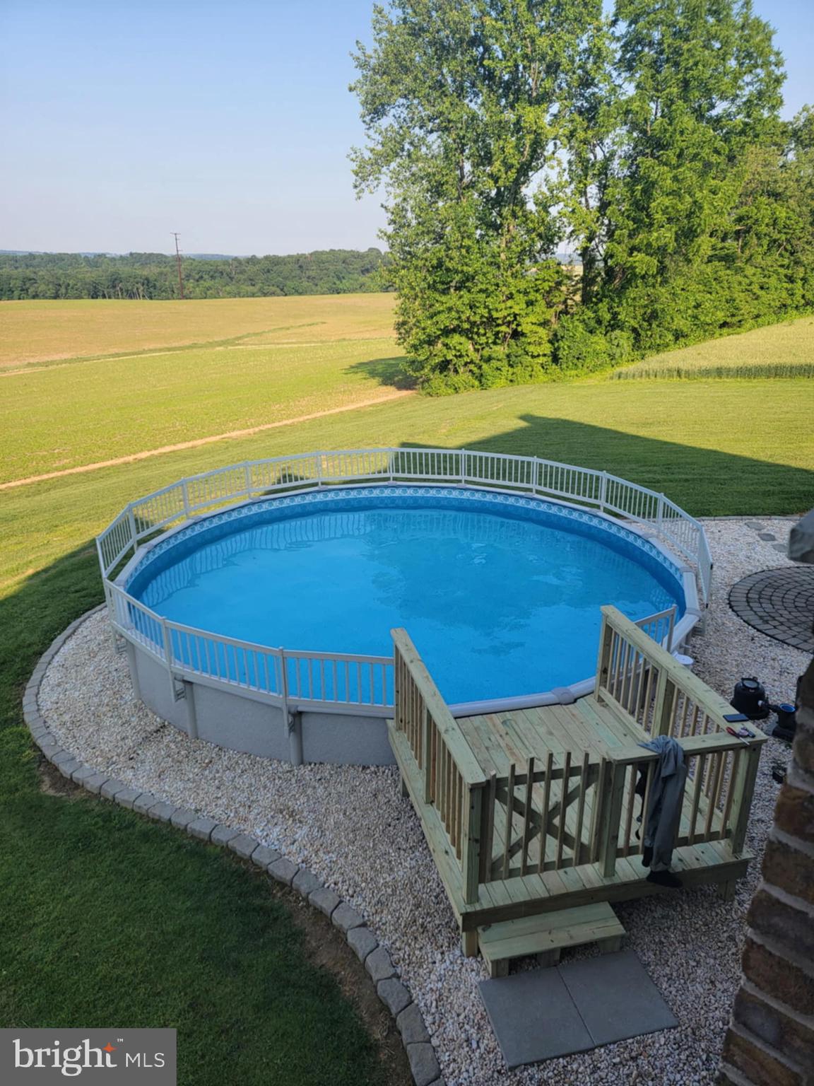 9185 High Rock Road New Park, PA 17352 - Photo 35 of 52 a view of a backyard with lawn chairs and a swimming pool