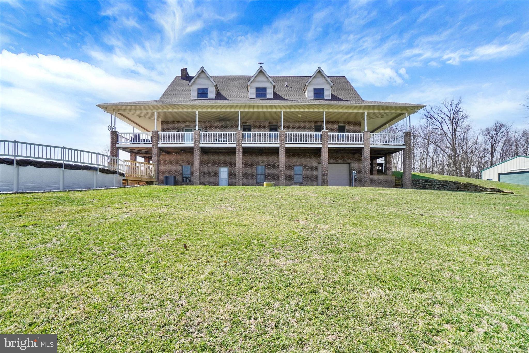 9185 High Rock Road New Park, PA 17352 - Photo 38 of 52 a front view of a house with garden