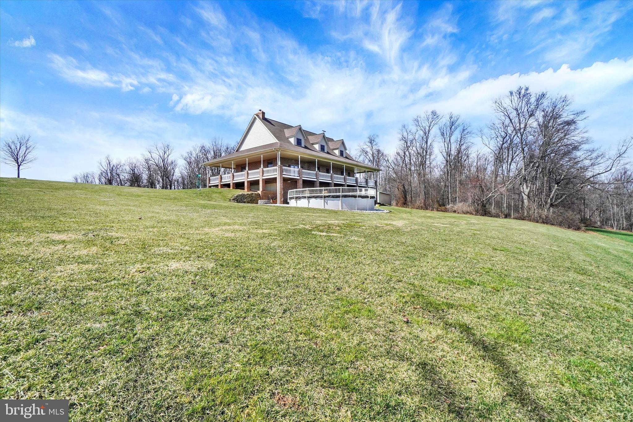 9185 High Rock Road New Park, PA 17352 - Photo 39 of 52 a yellow and red house sitting in the middle of a yard