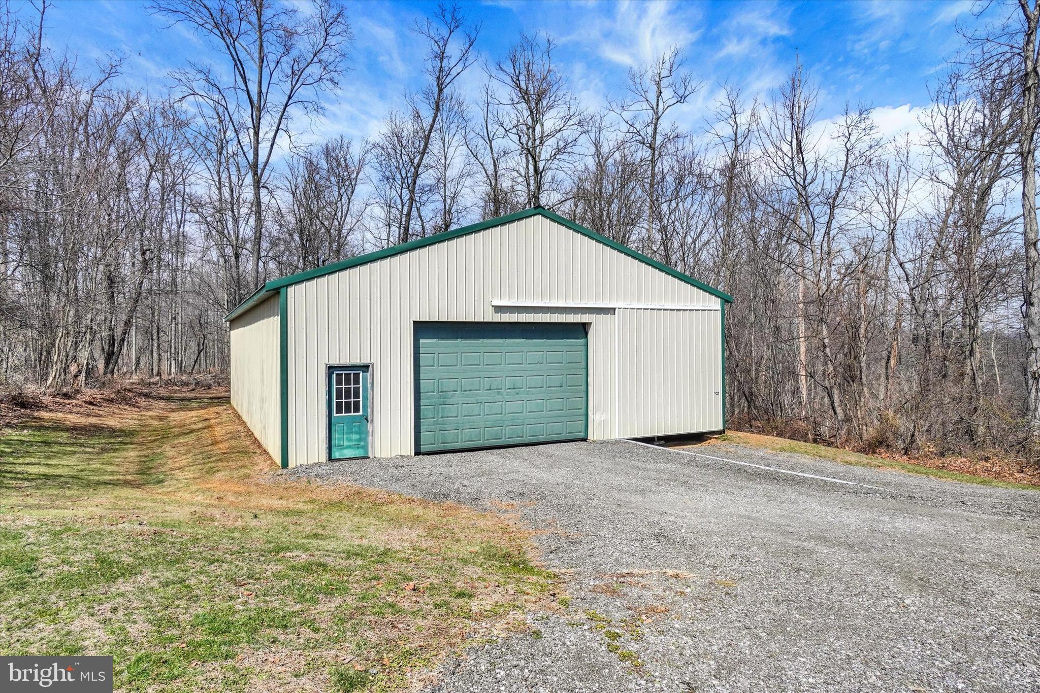 9185 High Rock Road New Park, PA 17352 - Photo 47 of 52 a view of a house with a yard and garage