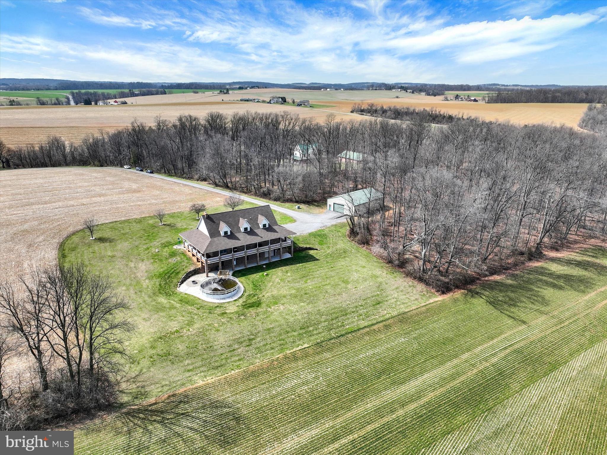 9185 High Rock Road New Park, PA 17352 - Photo 7 of 52 a view of a lake with couches in the back yard