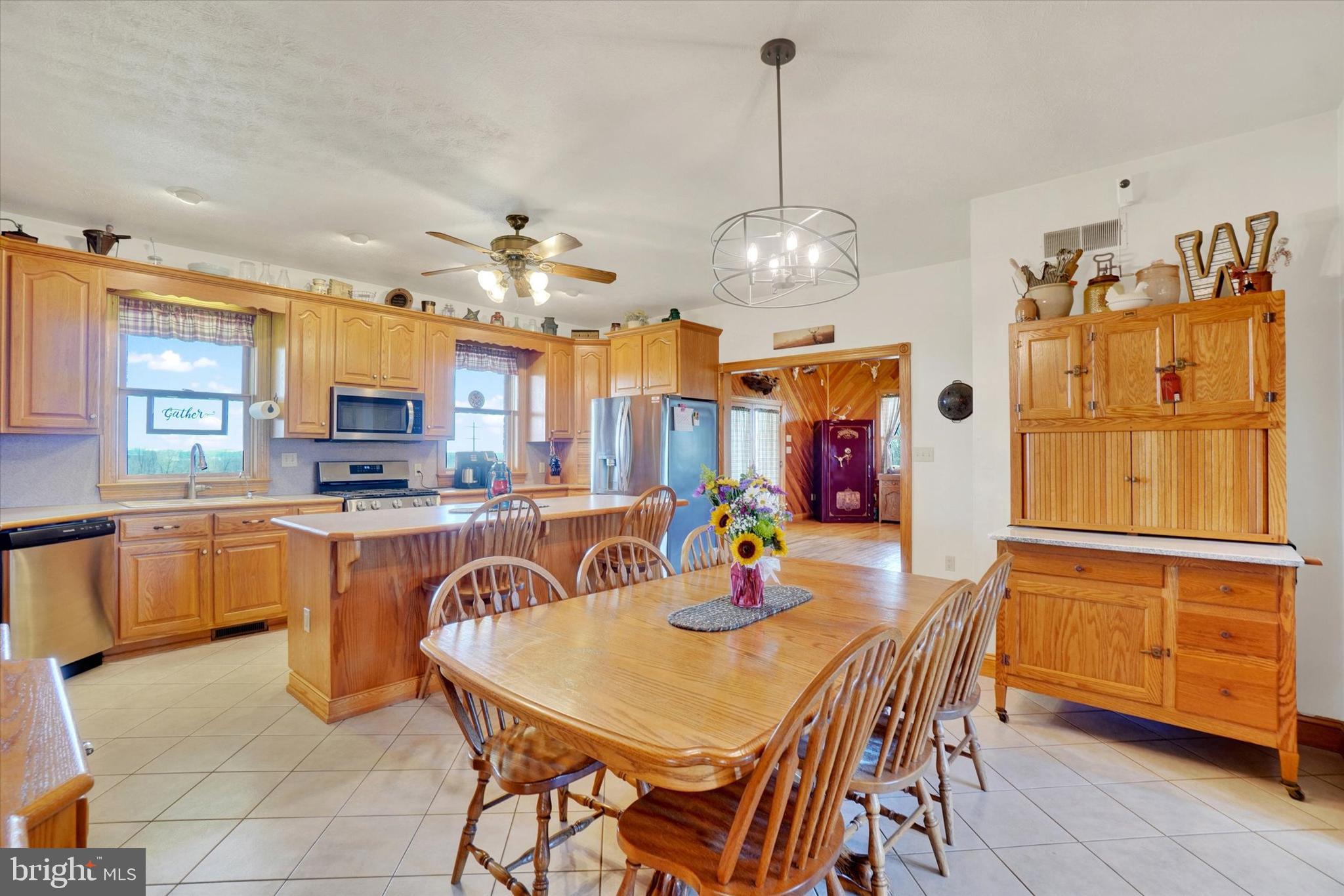 9185 High Rock Road New Park, PA 17352 - Photo 10 of 52 a view of a dining room with furniture and chandelier