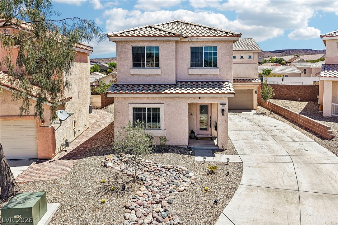 1176 Butternut Ranch Court Henderson, NV 89052 - Photo 47 of 60 A charming stucco residence with a classic tile roof and low-maintenance desert landscaping.