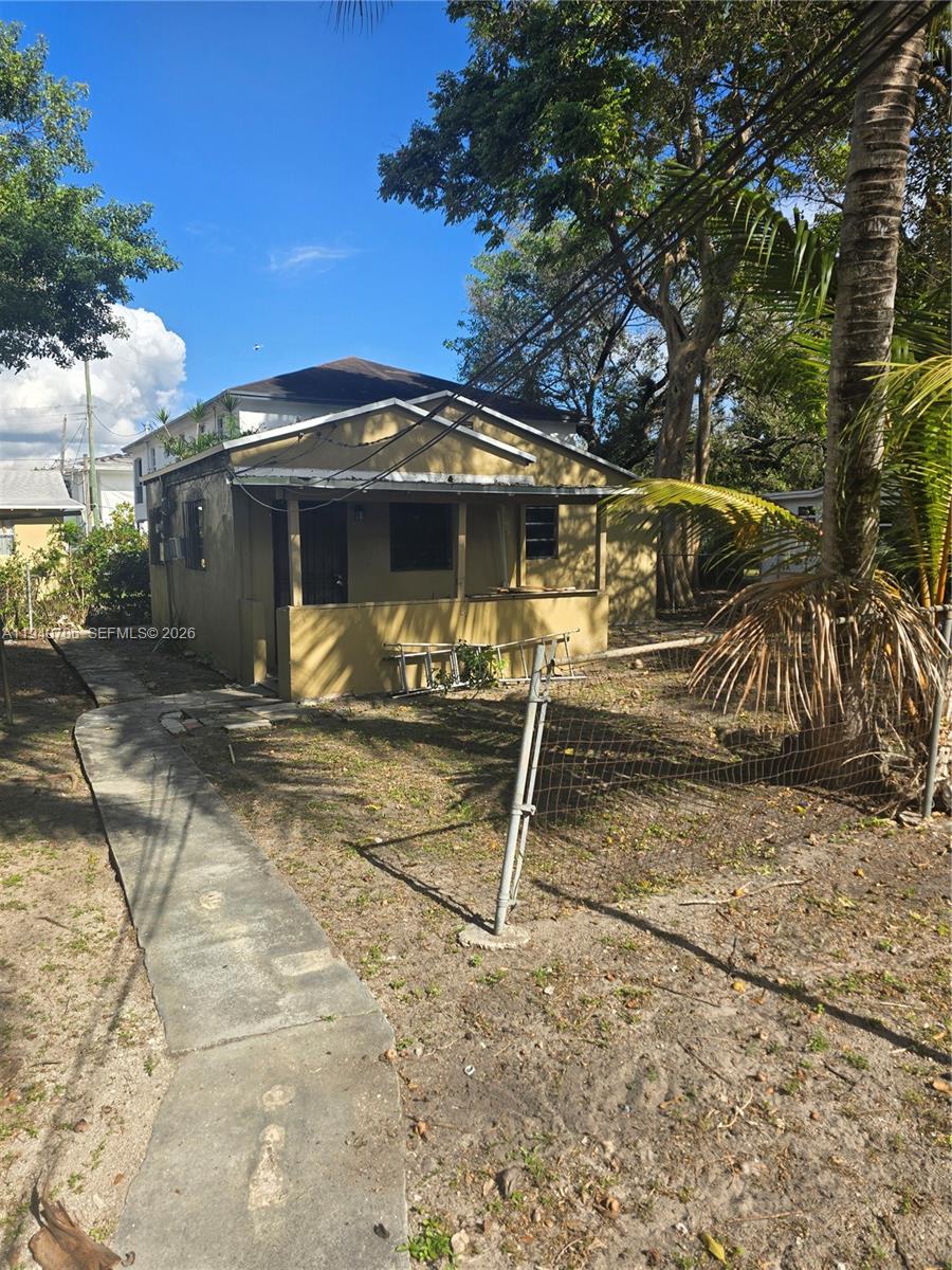 143 Northwest 69th Street, Unit 3 Miami, FL 33150 - Photo 2 of 7 a view of a house with backyard
