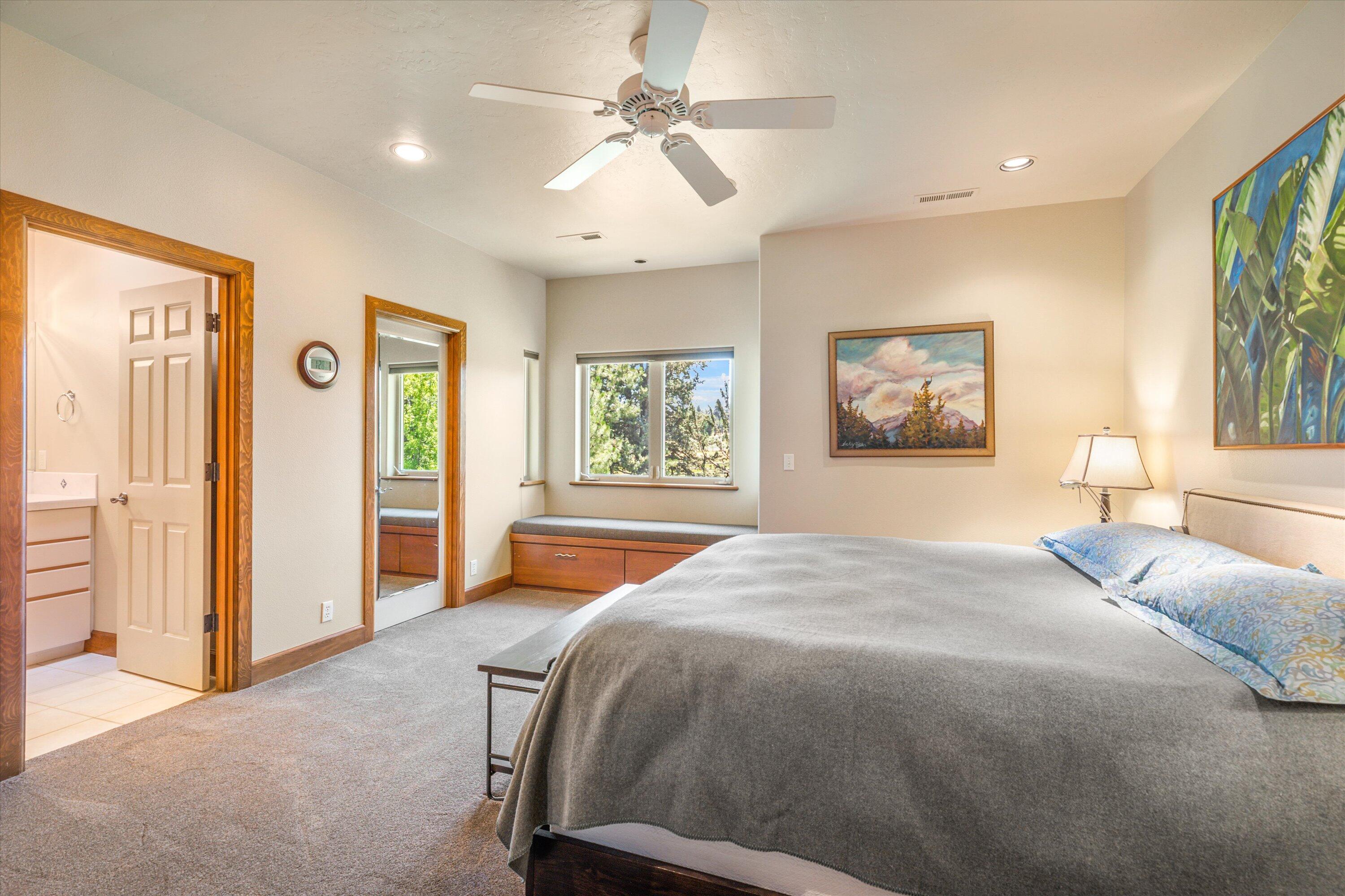 60540 Woodside Road Bend, OR 97702 - Photo 21 of 38 a bedroom with a large bed and a window