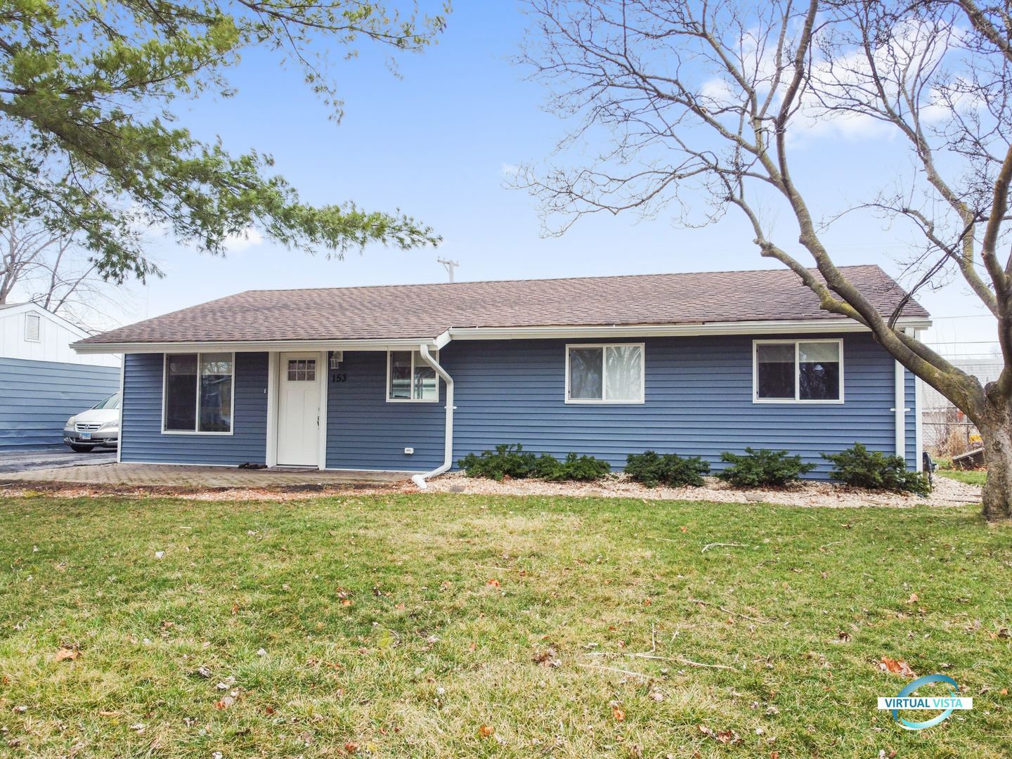 153 Queenswood Road Bolingbrook, IL 60440 - Photo 1 of 17 a front view of a house with a yard