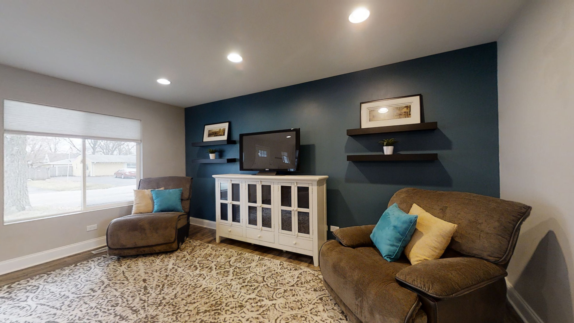 153 Queenswood Road Bolingbrook, IL 60440 - Photo 11 of 17 a living room with furniture and a flat screen tv