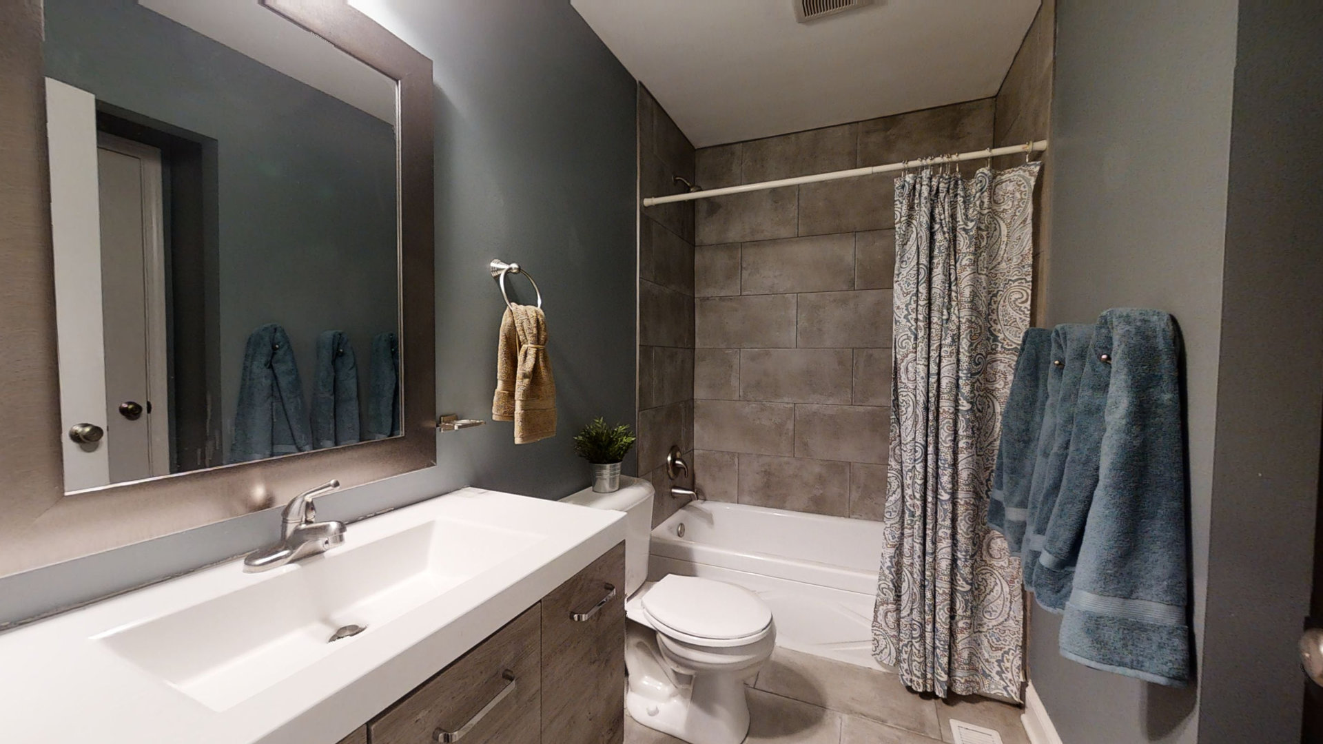 153 Queenswood Road Bolingbrook, IL 60440 - Photo 14 of 17 a bathroom with a sink mirror toilet and shower
