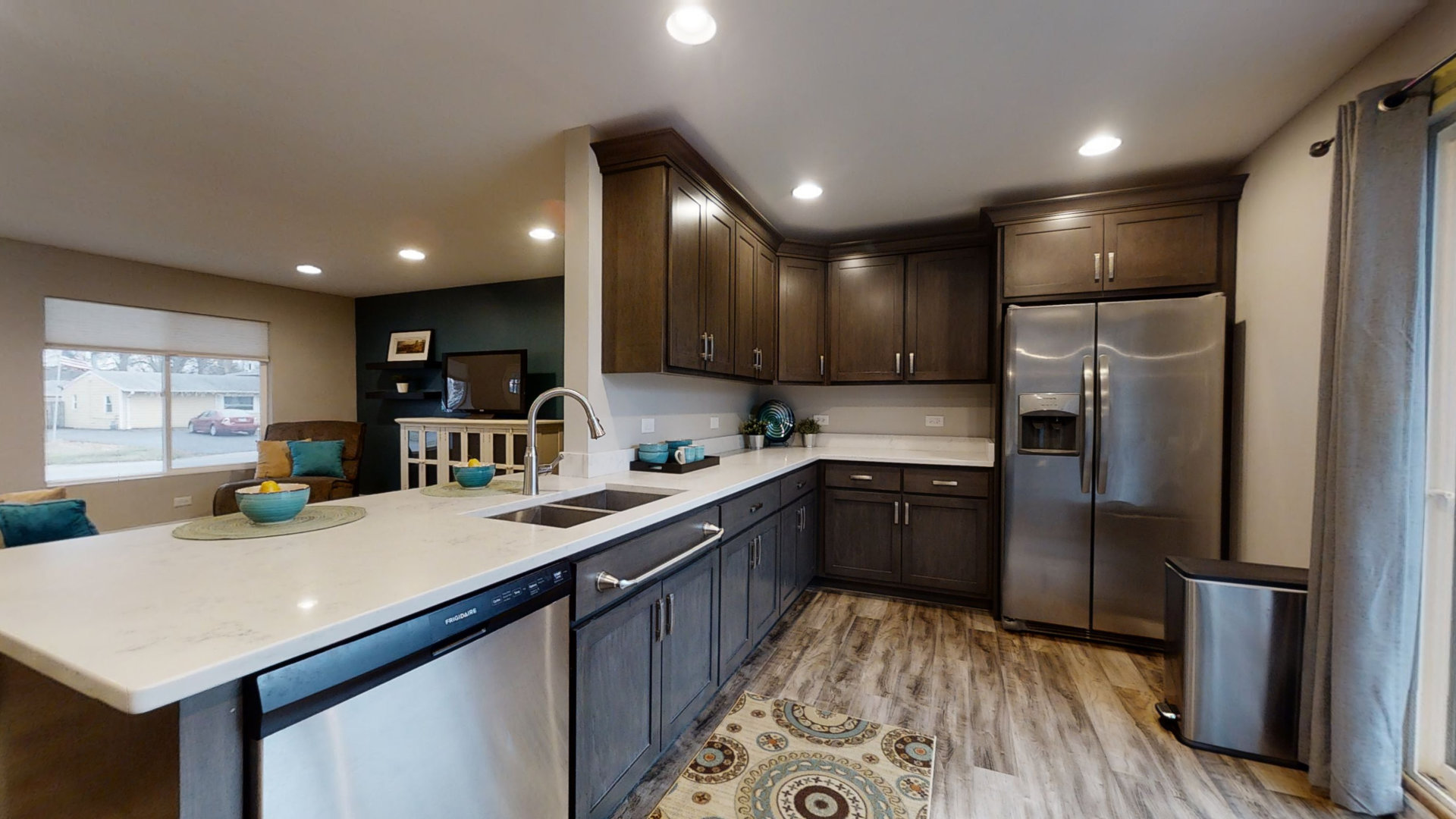 153 Queenswood Road Bolingbrook, IL 60440 - Photo 5 of 17 a kitchen with stainless steel appliances granite countertop a sink refrigerator and cabinets
