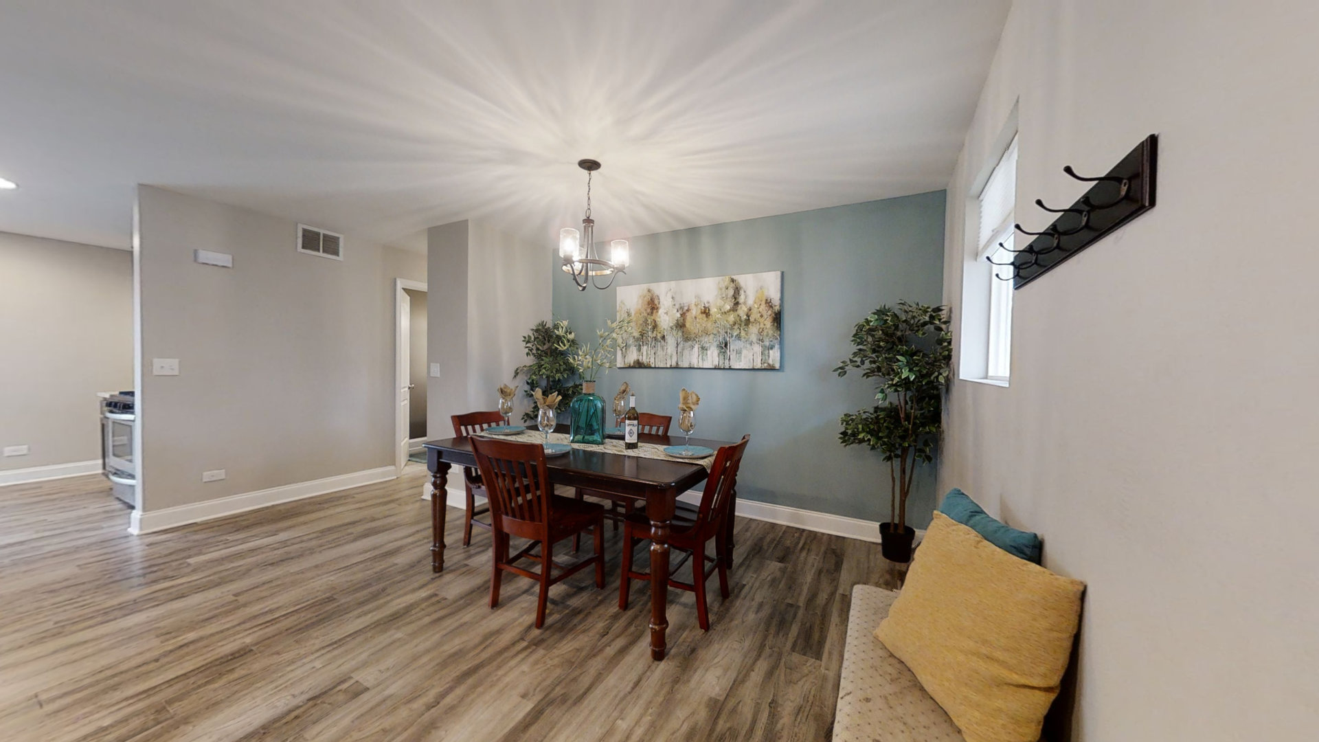 153 Queenswood Road Bolingbrook, IL 60440 - Photo 10 of 17 a view of a dining room with furniture and wooden floor