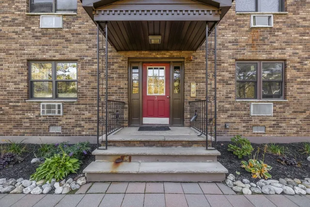 a front view of a house with stairs