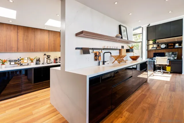 a kitchen with stainless steel appliances a stove and cabinets